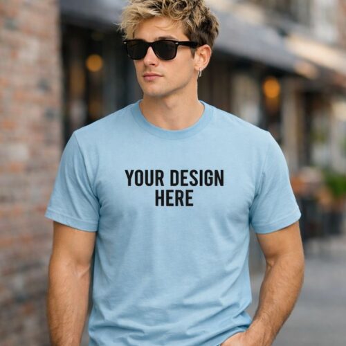 Custom Light Blue T-shirt (2) Light blue round neck men’s t-shirt with customizable front print area, worn by male model outdoors